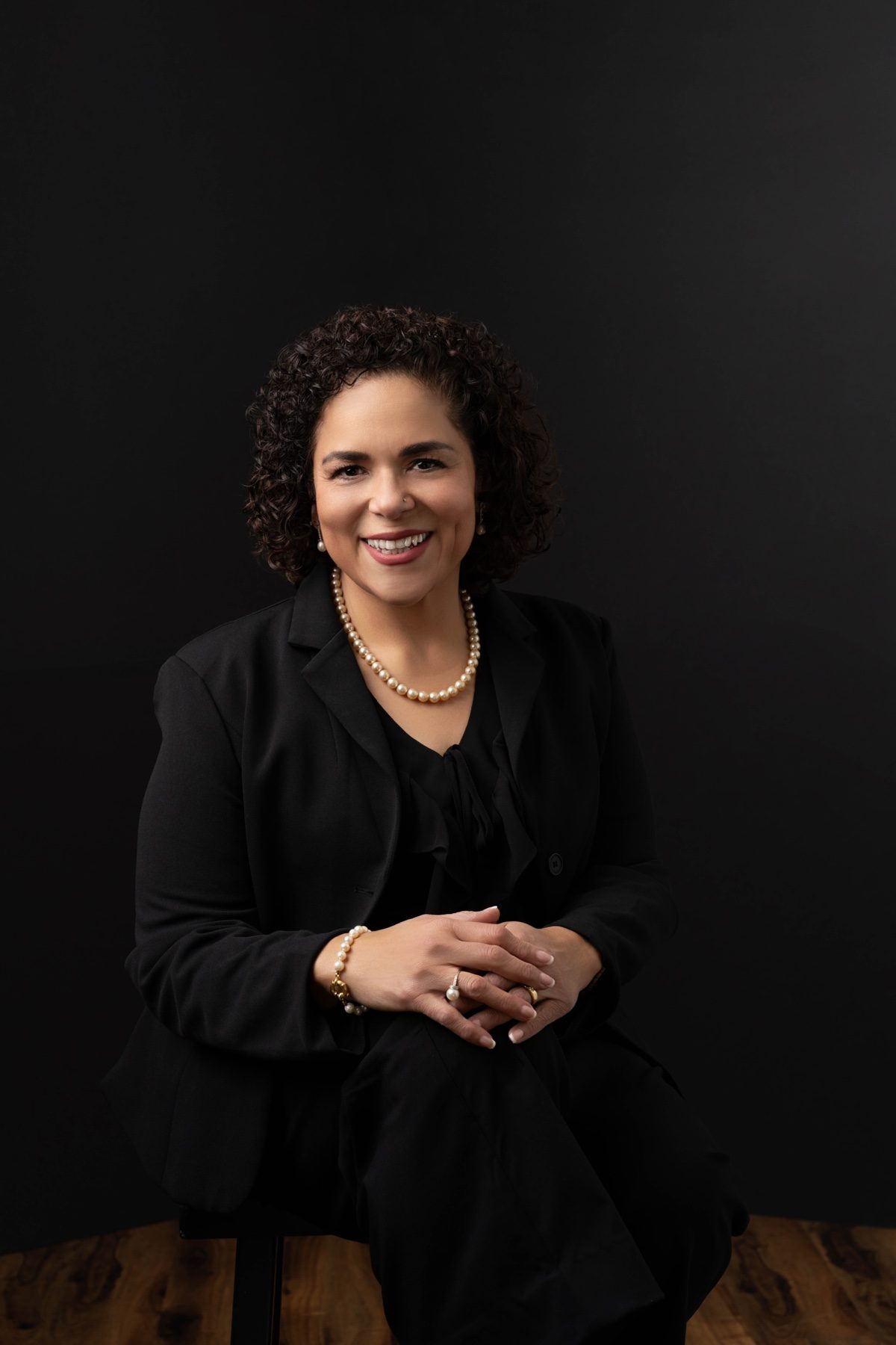 Maria F. Espinosa seated in a formal founder portrait