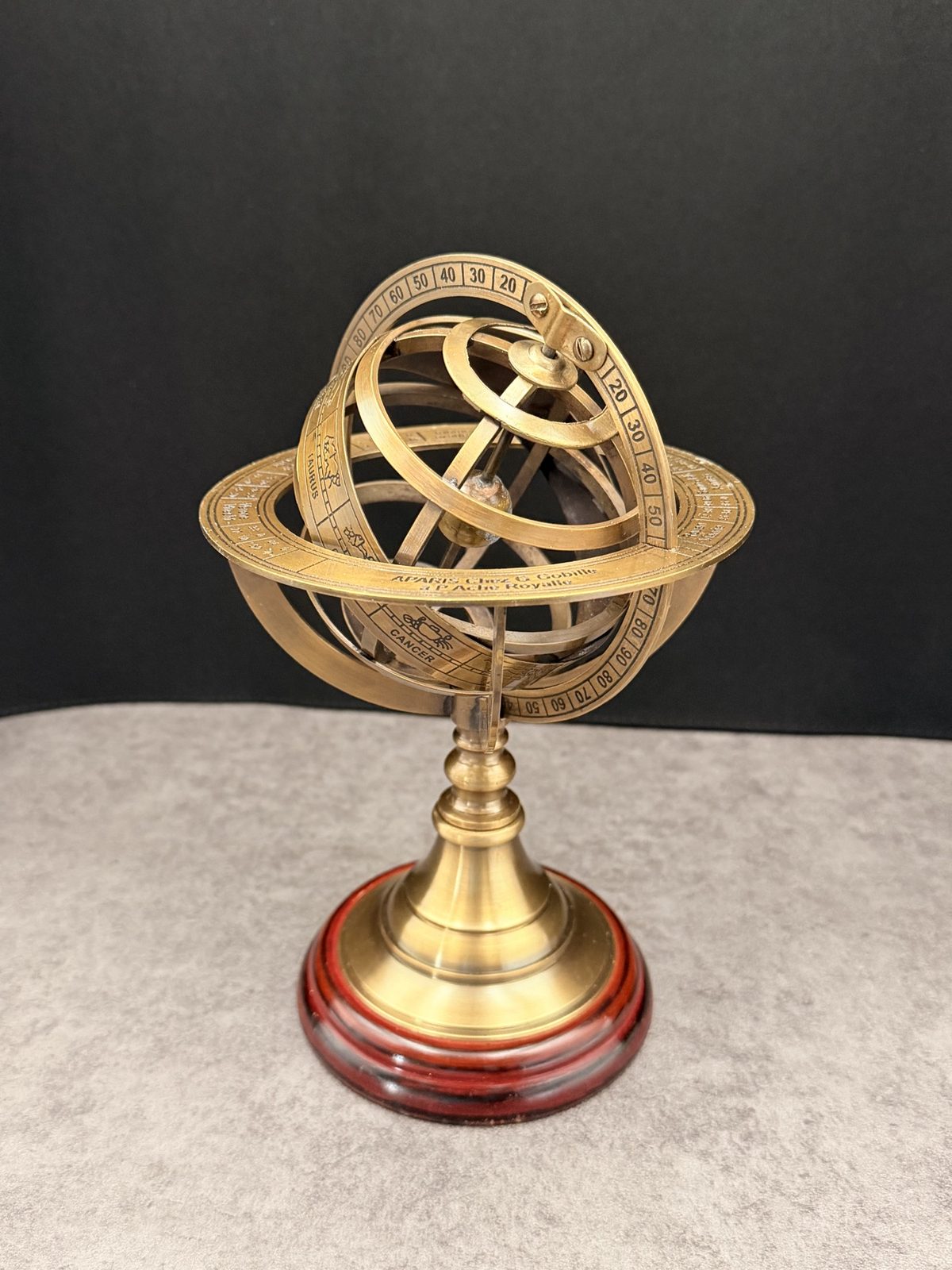 Brass armillary sphere showing intersecting rings and a central axis